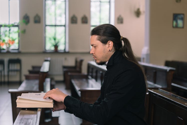 A Man Reading The Bible