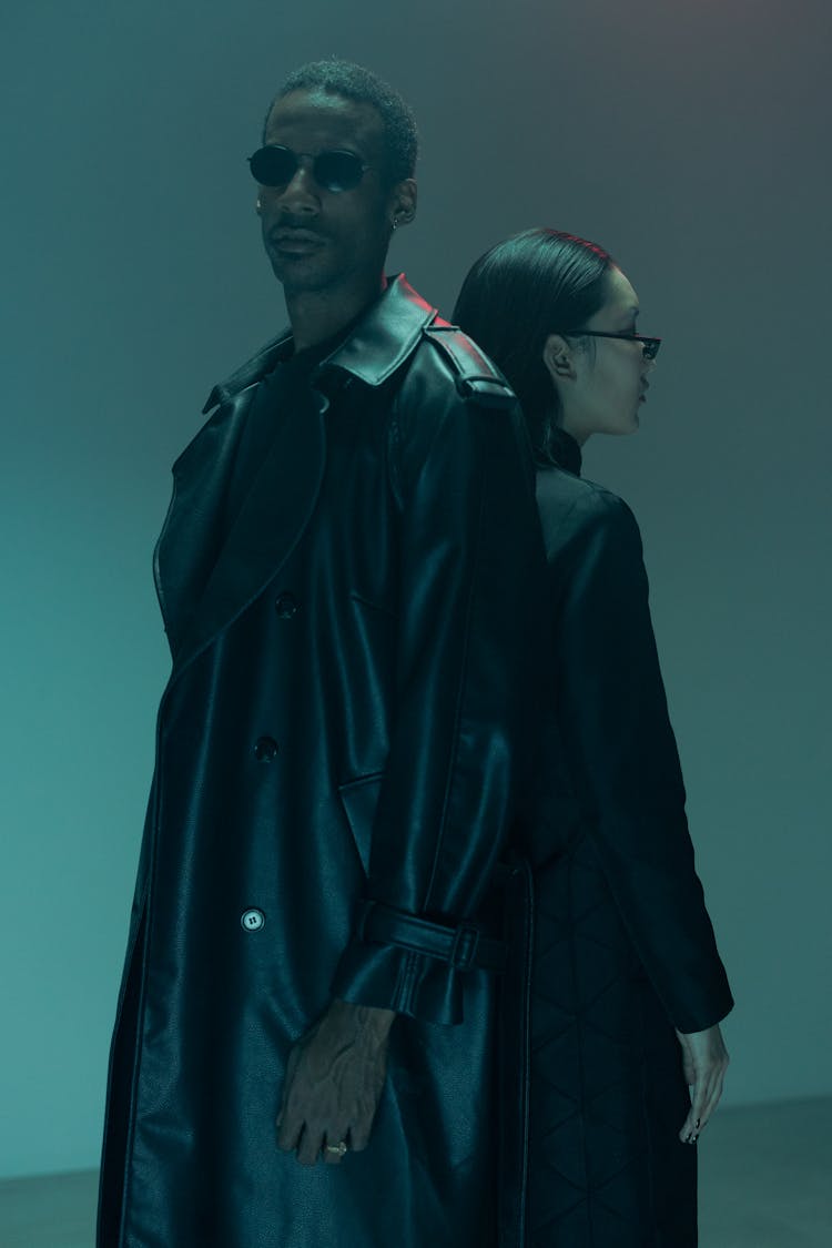 Man And Woman In Black Leather Coats Wearing Sunglasses