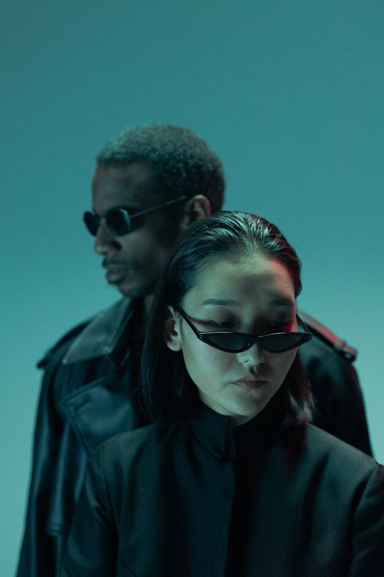 Man And A Woman Wearing Sunglasses