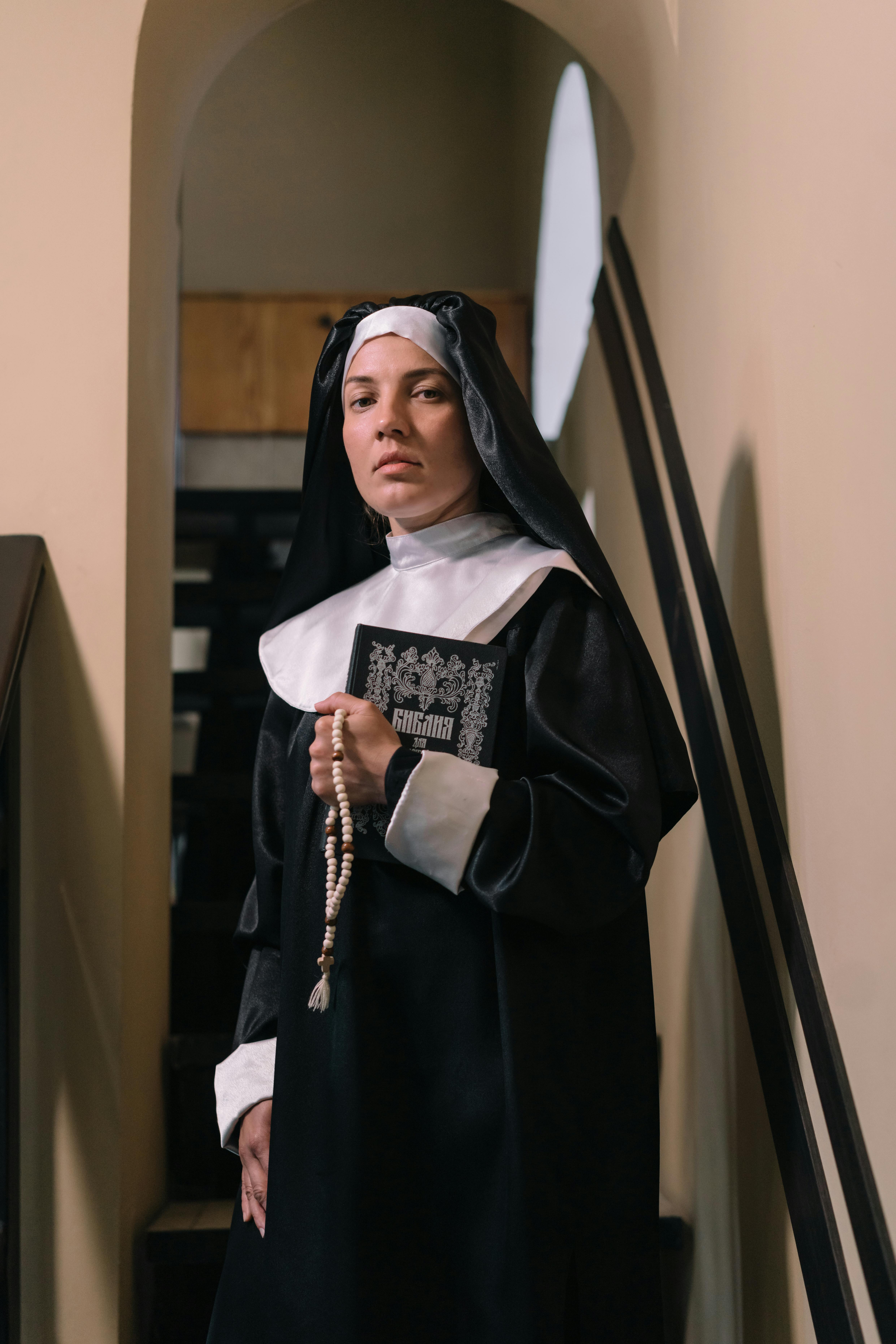 sister holding a bible and rosary