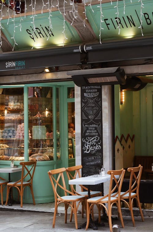 Wooden Chairs and Table Outside of the Coffee Shop