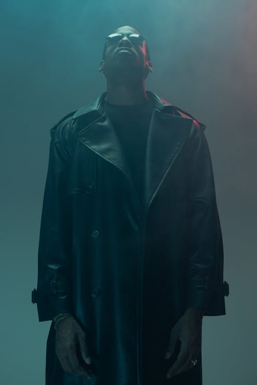 A Man in Leather Coat Looking Up