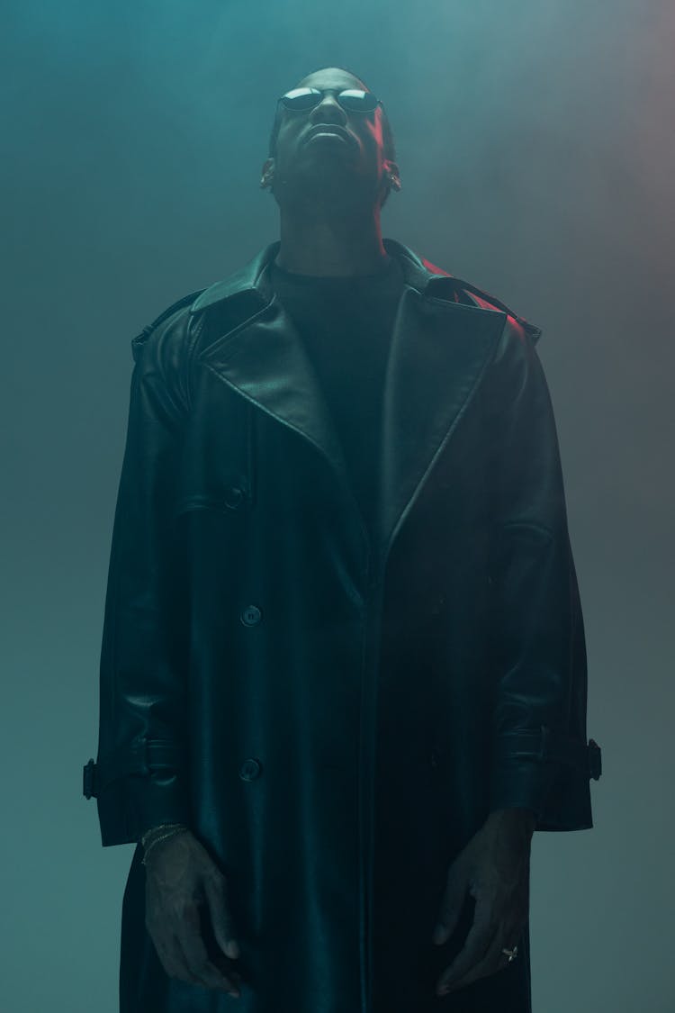 A Man In Leather Coat Looking Up