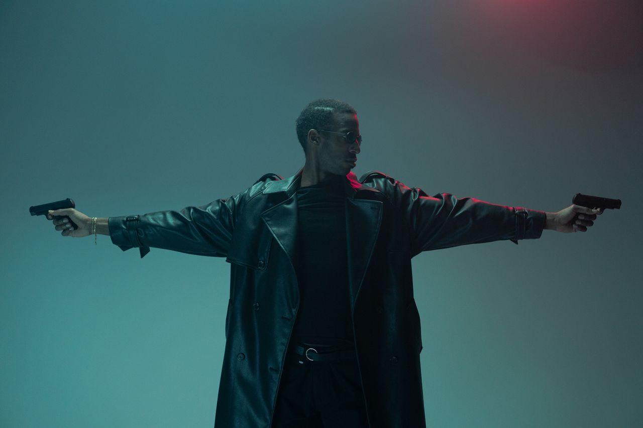 a powerful and stylish conceptual portrait of a man in a leather coat