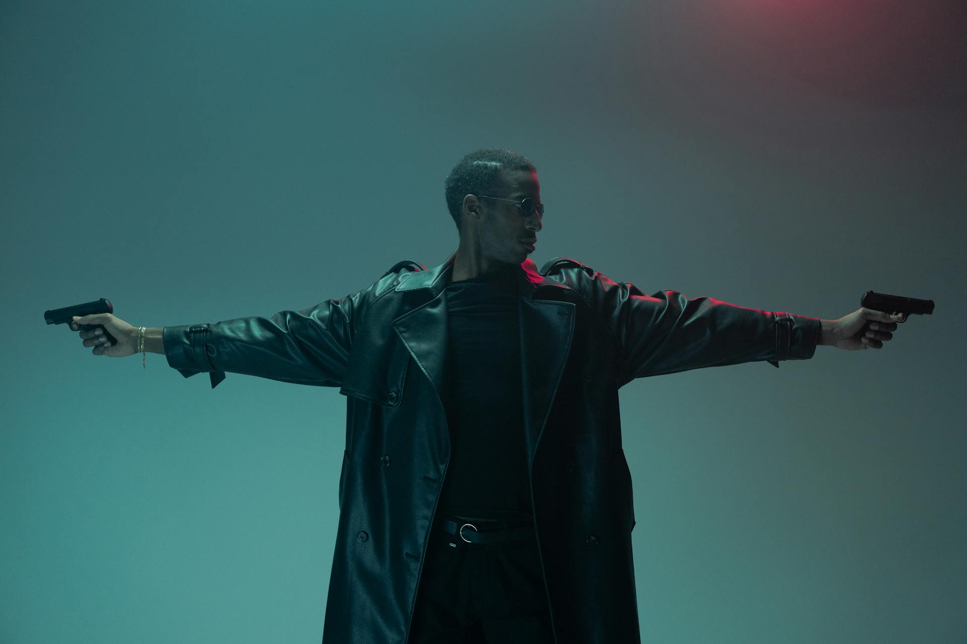 A powerful and stylish conceptual portrait of a man in a leather coat with firearms, evoking a cyberpunk matrix theme.