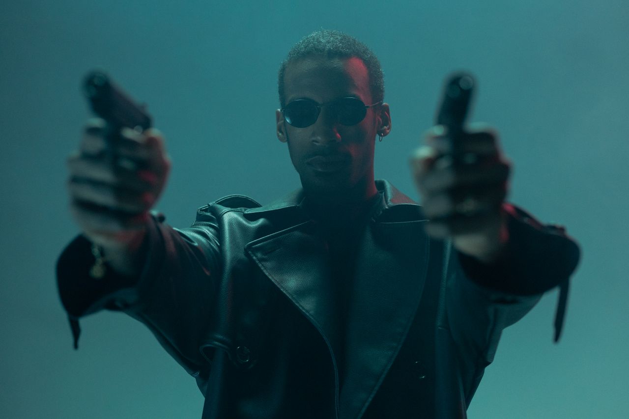 conceptual cyberpunk image featuring an individual in a leather coat h