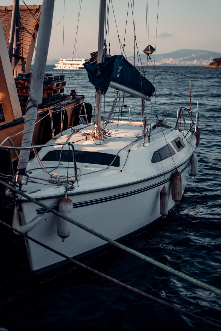 Small Yacht Docked By Pier