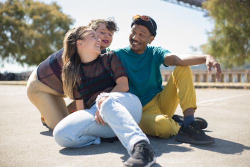 Free Friends Sitting on the Street Stock Photo