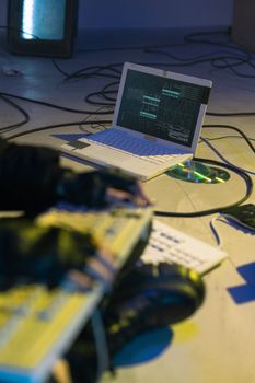 Laptop with coding software on-screen, symbolizing cybersecurity and tech innovation.