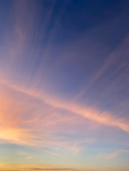 A stunning sky with vibrant colors during sunset, showcasing a beautiful cloudscape.