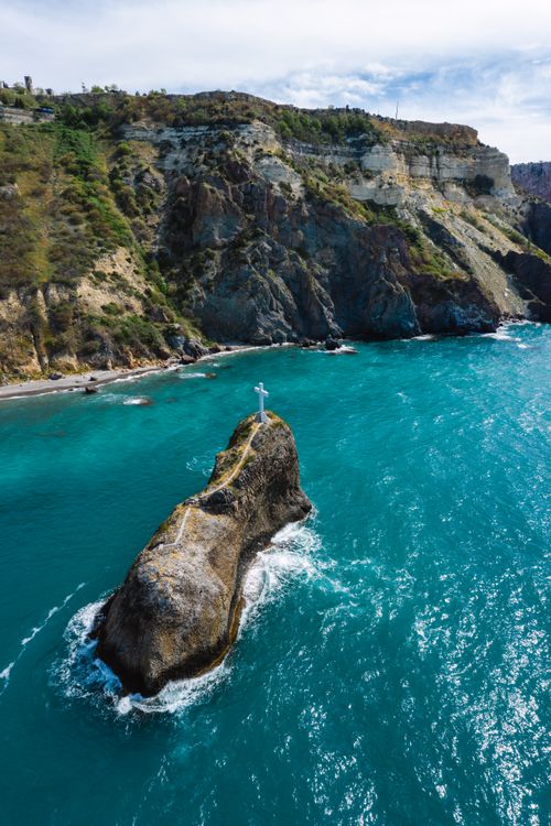 Free Stunning aerial shot of Sevastopol's coastal cliffs with turquoise waters and rocky formations. Stock Photo