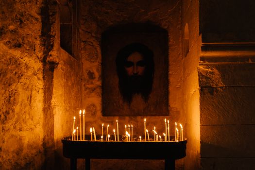 Medieval Stone Altar with Lighted Candles