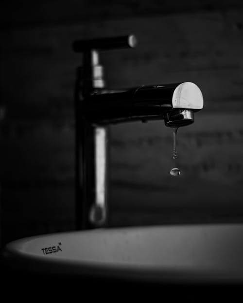 Free Grayscale Photo of Water Drop from a Faucet Stock Photo