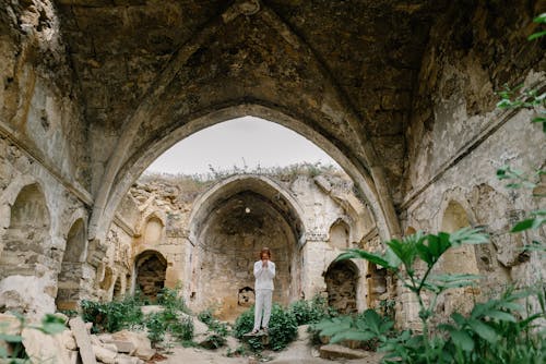 Man Standing on a Rock Praying