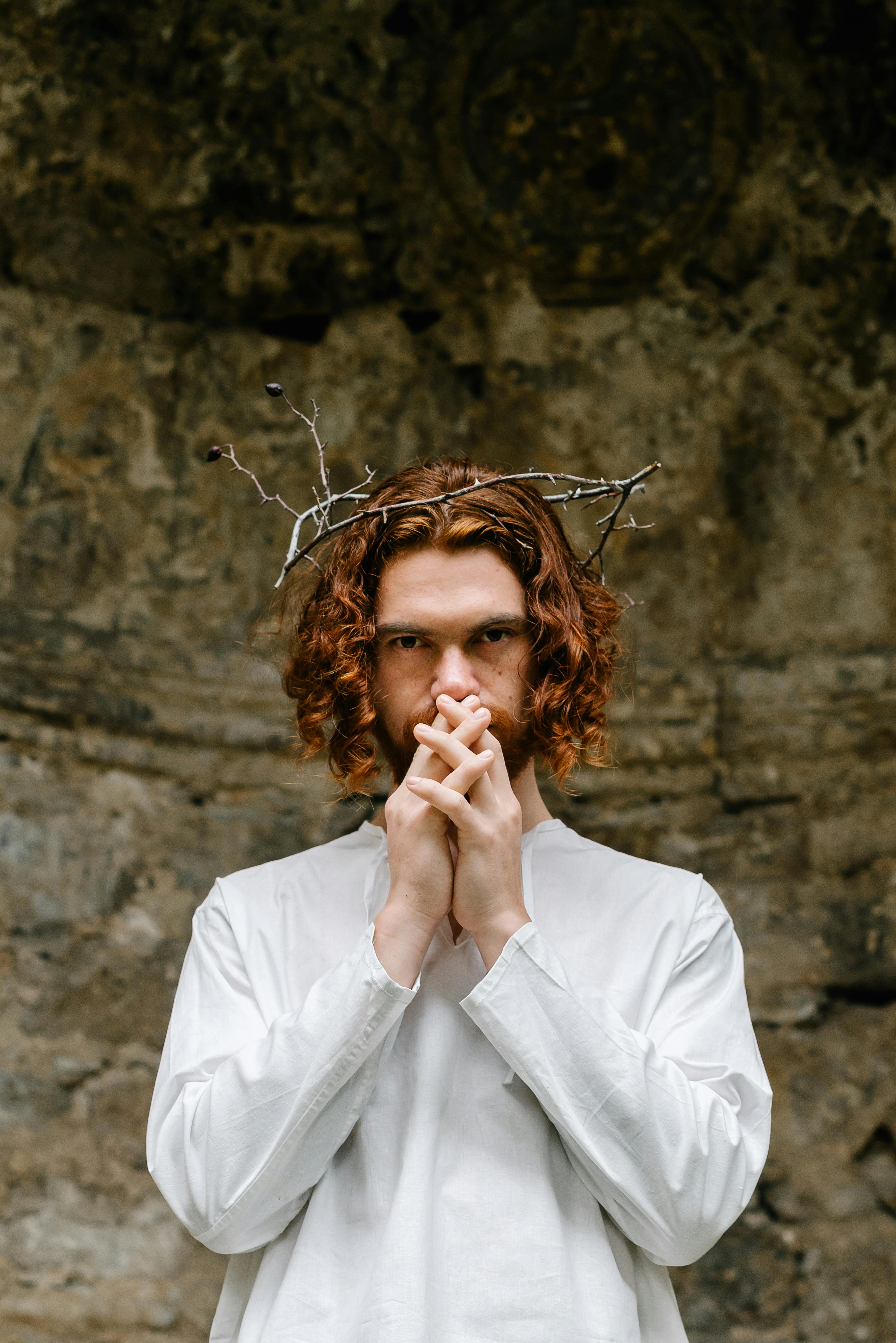 man wearing crown of thorns