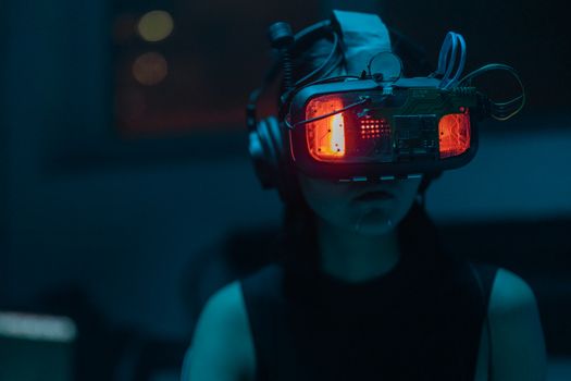 A Woman in a Tank Top Using a VR Headset