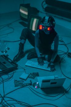 A woman immersed in virtual reality with futuristic goggles, surrounded by technology and cables.