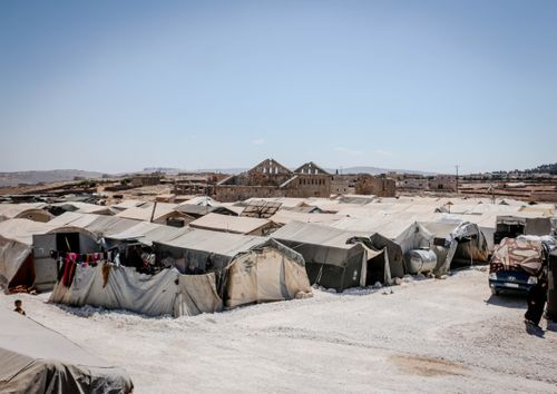 Free Tents in Refugee Camp in Desert Stock Photo