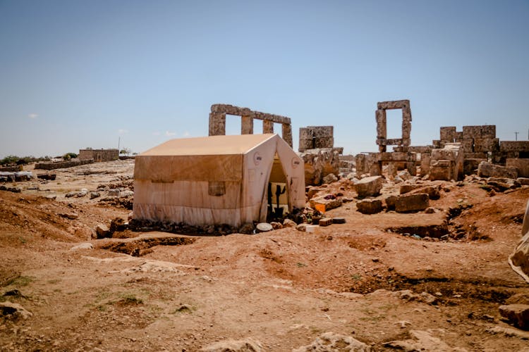 Tent And Ancient Ruins On A Desert 