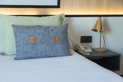 Cushions on Bed in Hotel Room