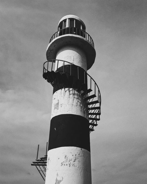 Free A striking black and white photograph of a lighthouse with spiral staircase in Cancún, Mexico. Stock Photo
