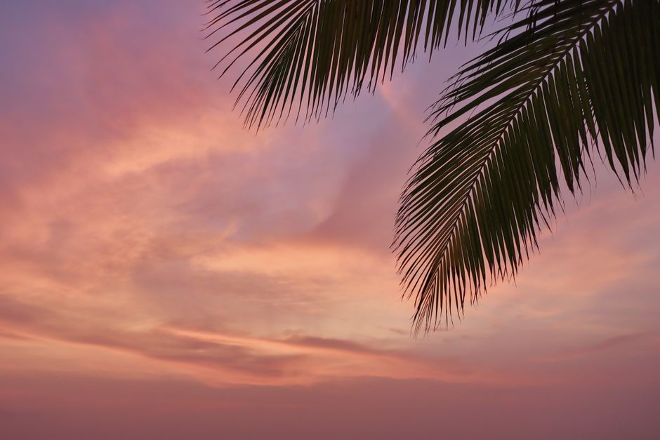 Tourists enjoying a Maldives sunset, emphasizing the need for sun protection