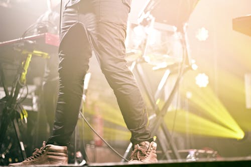 Free Person in Black Pants on Stage Stock Photo