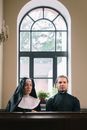 Man in Black Dress Shirt Standing Beside Woman in White Dress