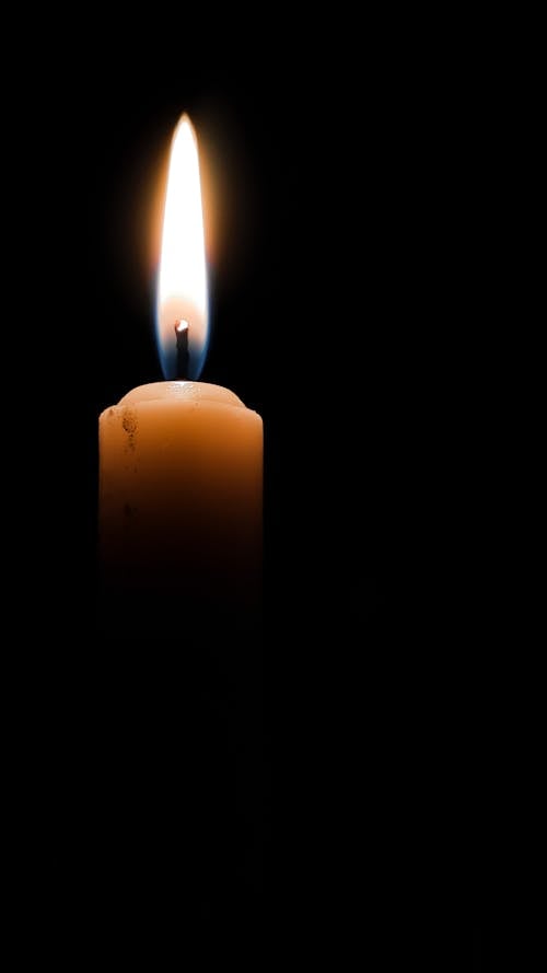 Free Close-Up Shot of Lighted Candle in the Dark Stock Photo