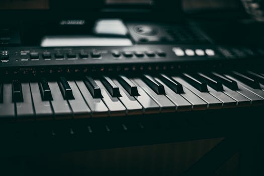 Detailed close-up of piano keys on an electronic keyboard with a moody atmosphere.