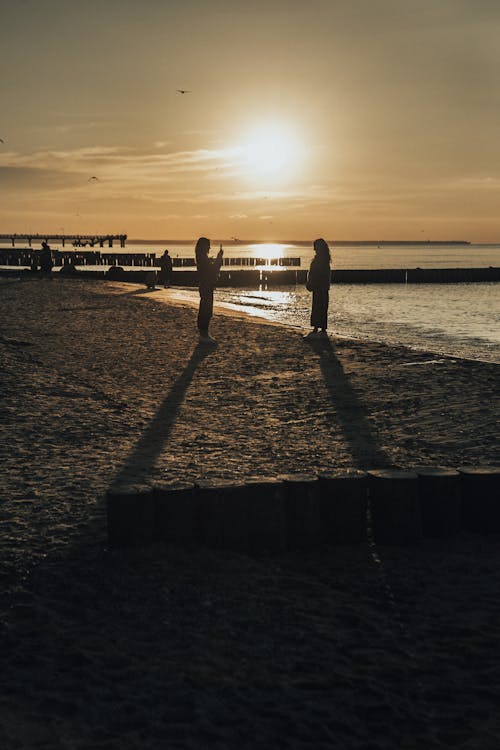 People at the Beach at Sunset 