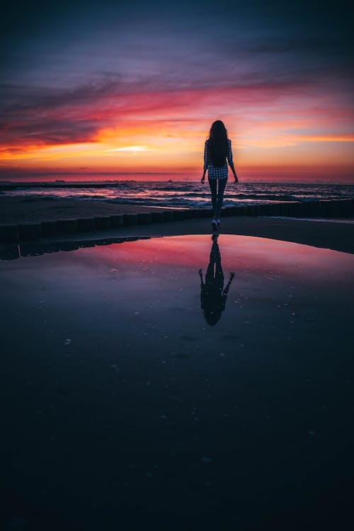 Woman on the Beach at Sunset 