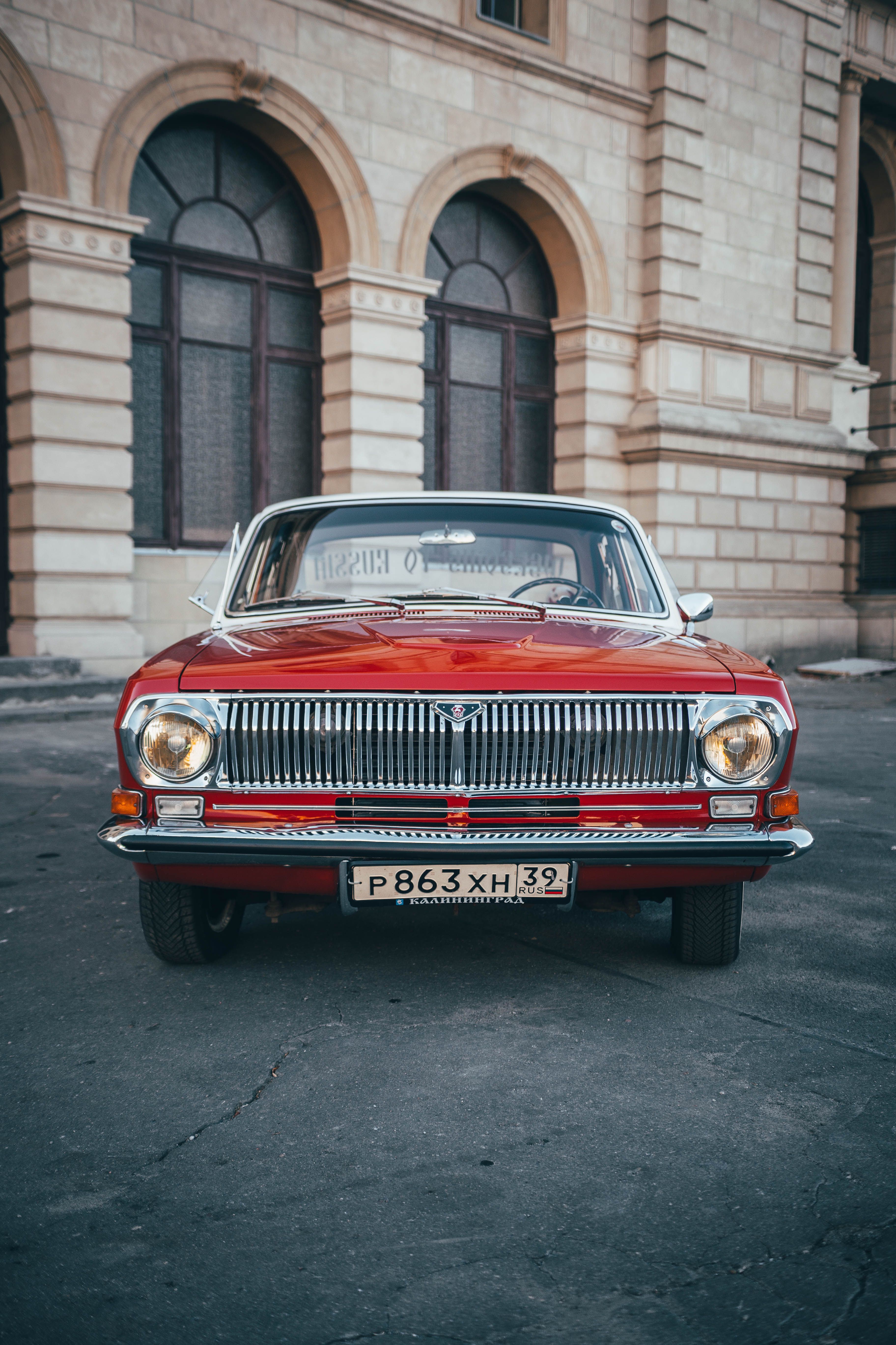 Photo of Red Classic Car parked on Roadside · Free Stock Photo