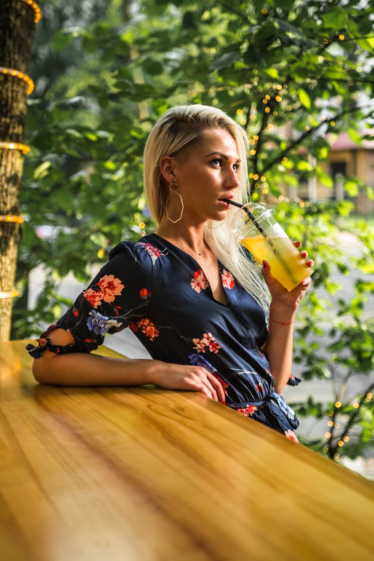 Blonde Woman Drinking Lemonade