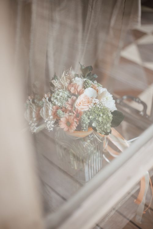 Free Soft focus image of a beautiful wedding bouquet behind a glass window. Stock Photo