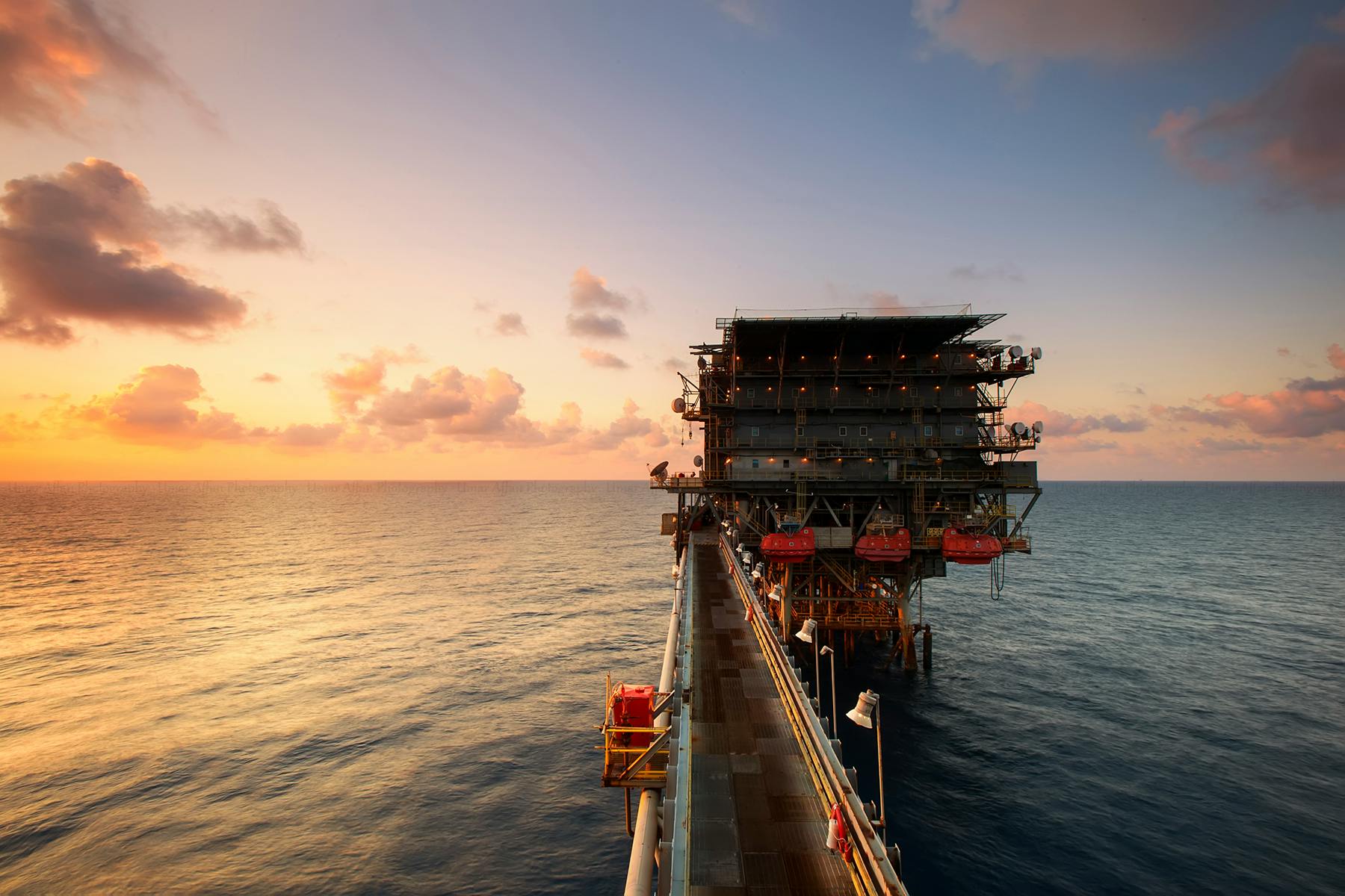 Heavy Equipment on Body of Water Under Blue and White Cloudy Skies