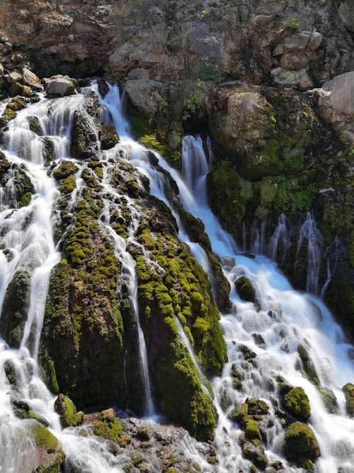 A Cascading Waterfalls on Rocky Mossy Mountain