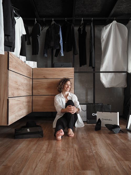 A Woman Sitting on the Floor of a Store