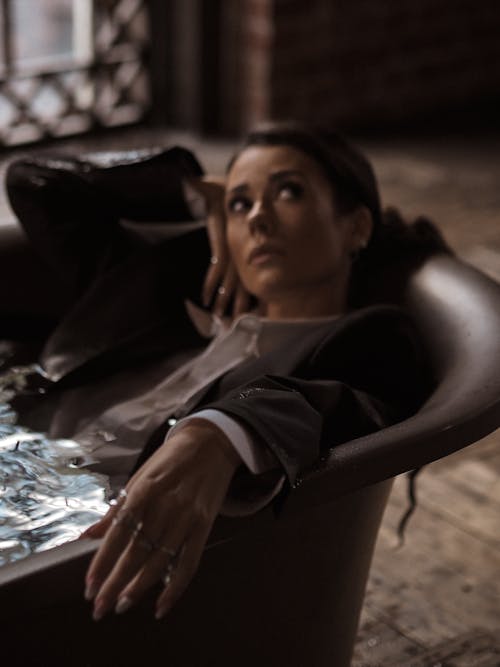 A Woman Sitting While Looking Up