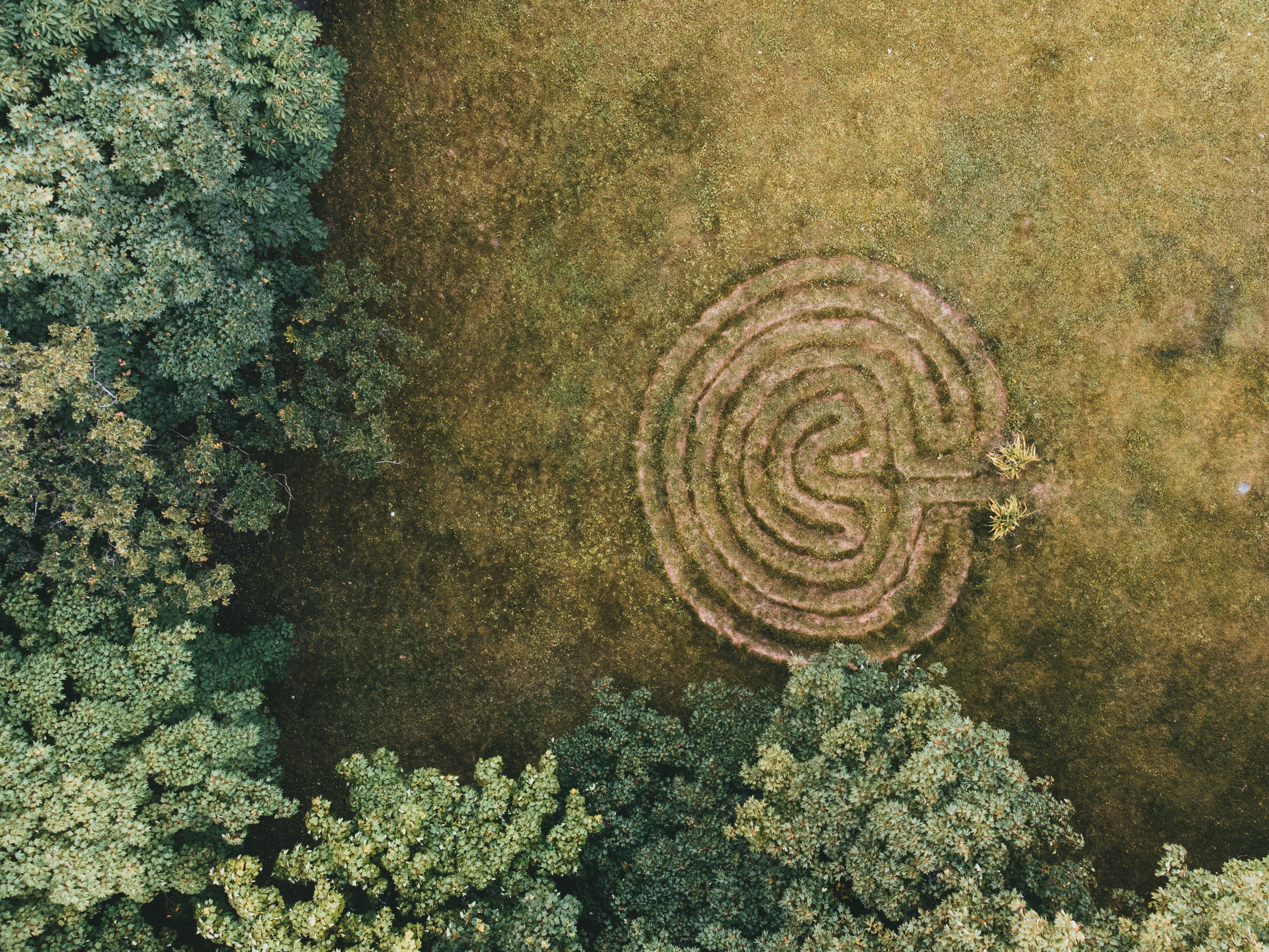 Aerial view of a labyrinth pattern representing hidden subconscious pathways