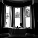 White Ceramic Bathtub Near Window