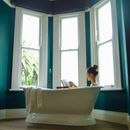 Woman in White Ceramic Bathtub