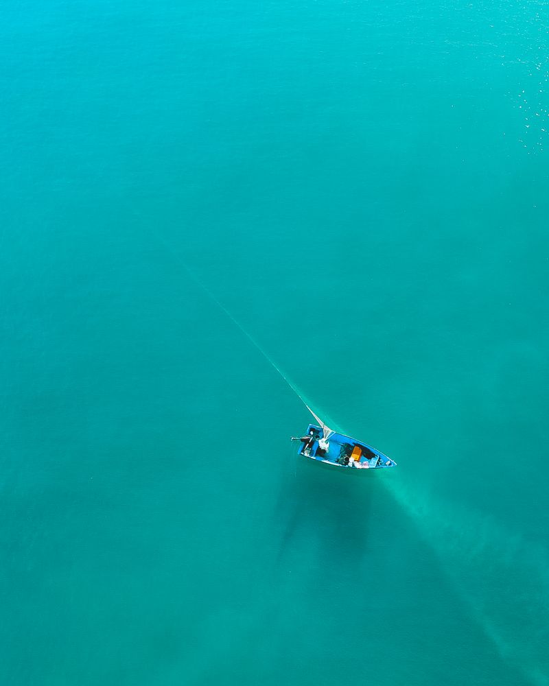 Drone shot of a boat underway on calm sea