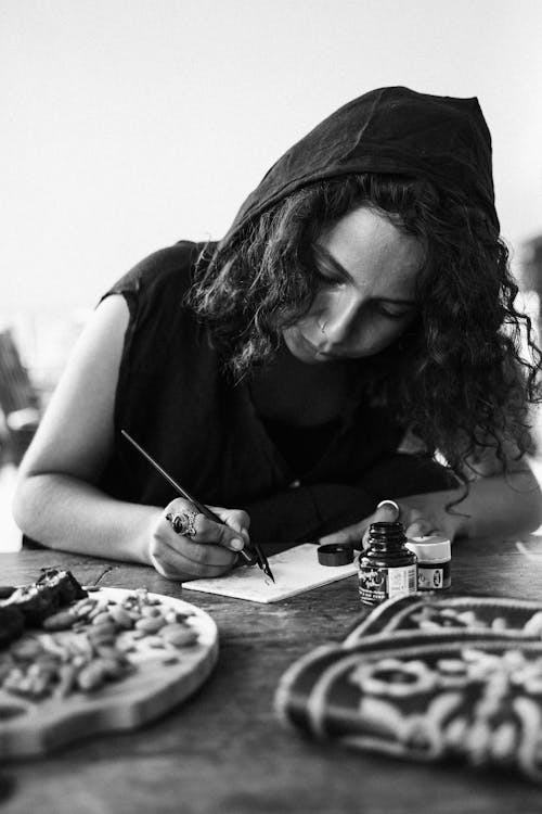 A Woman Writing using a Calligraphy Pen