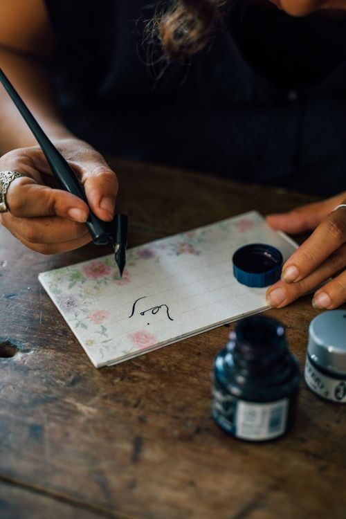 Person Writing on the Paper · Free Stock Photo