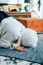 Person in White Long Sleeve Shirt Lying on Bed