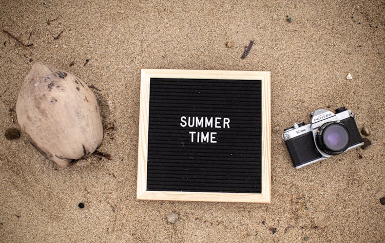 A Frame Beside A Camera On The Beach