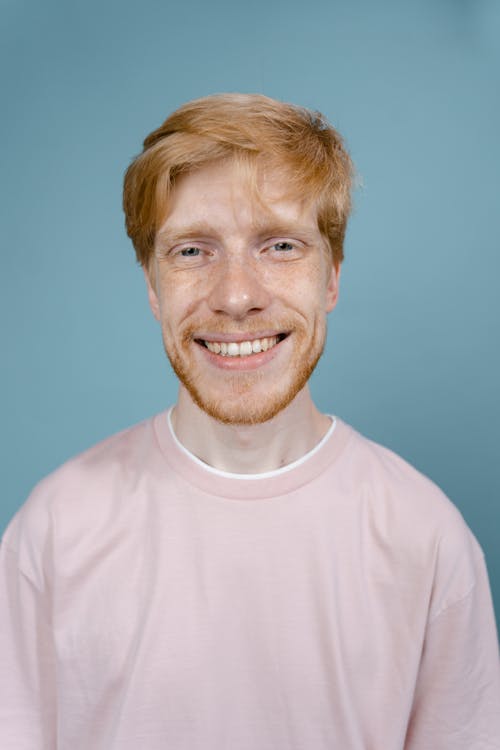 Free A Cheerful Man Smiling at the Camera Stock Photo