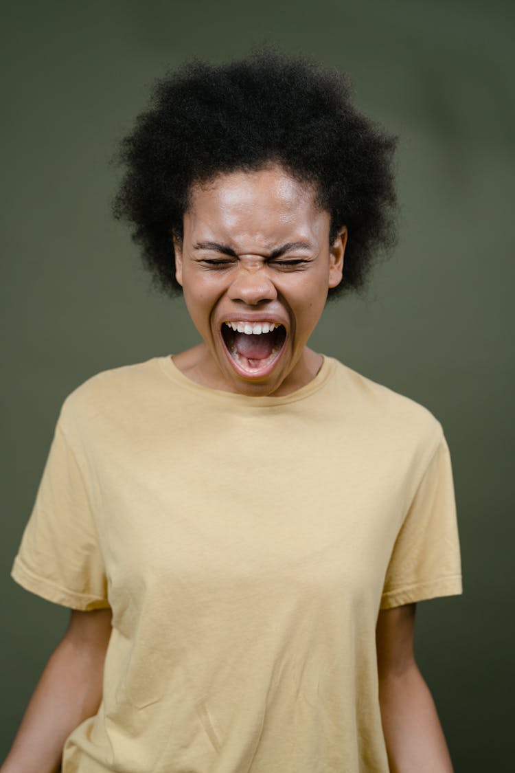 Woman In Yellow Shirt Shouting