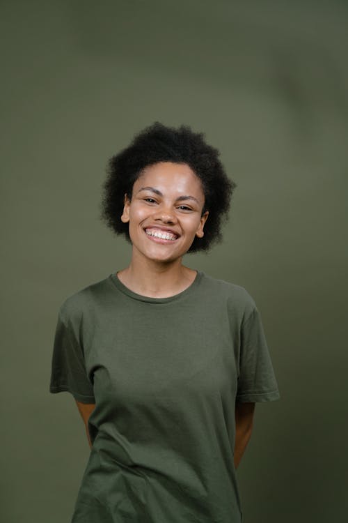 Cheerful Woman in Green Crew Neck T-shirt